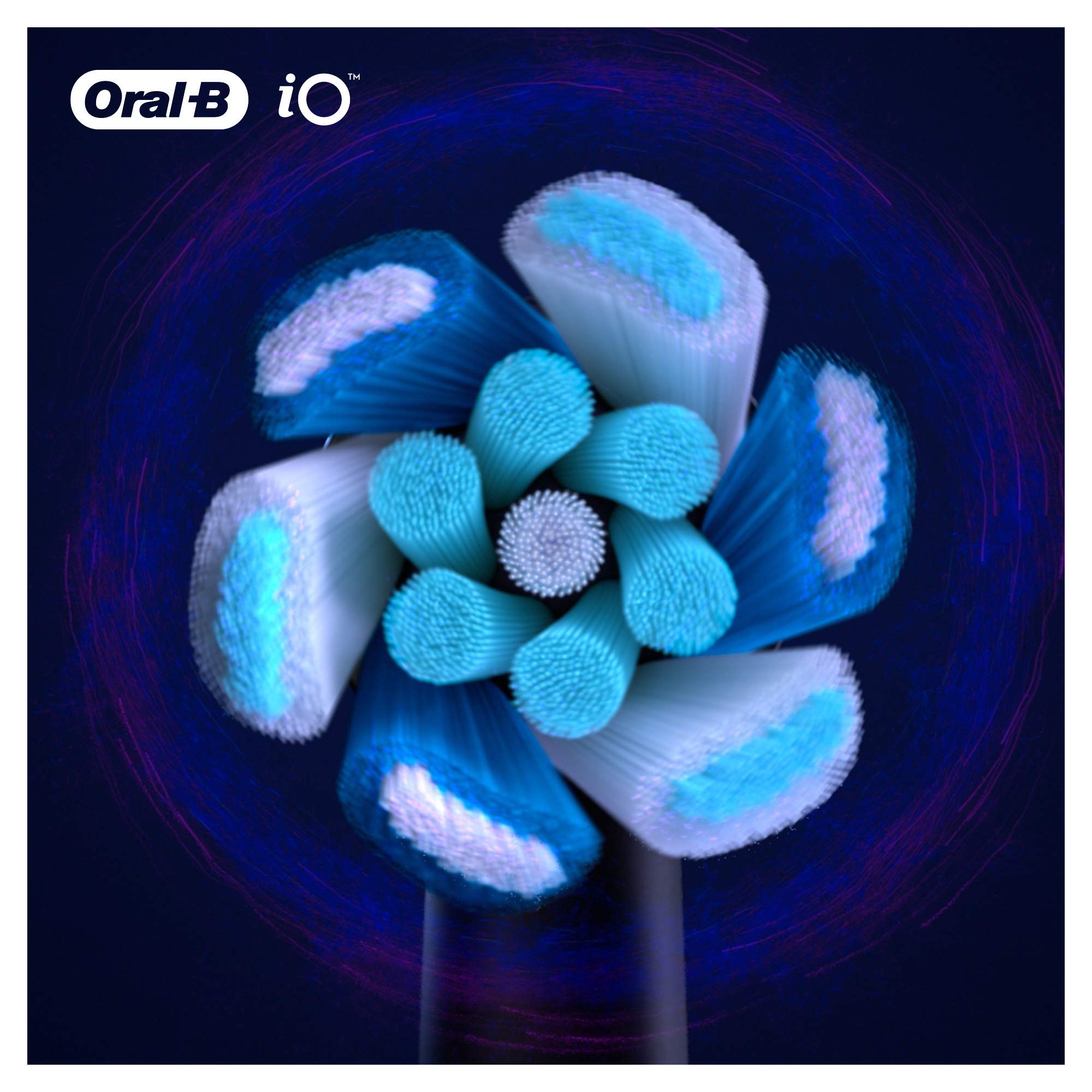 Oral-B brush head next to a coin to show compact size and travel-friendly scale