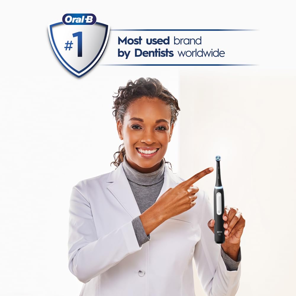 Oral-B iO3 toothbrush in hand during brushing showing easy use