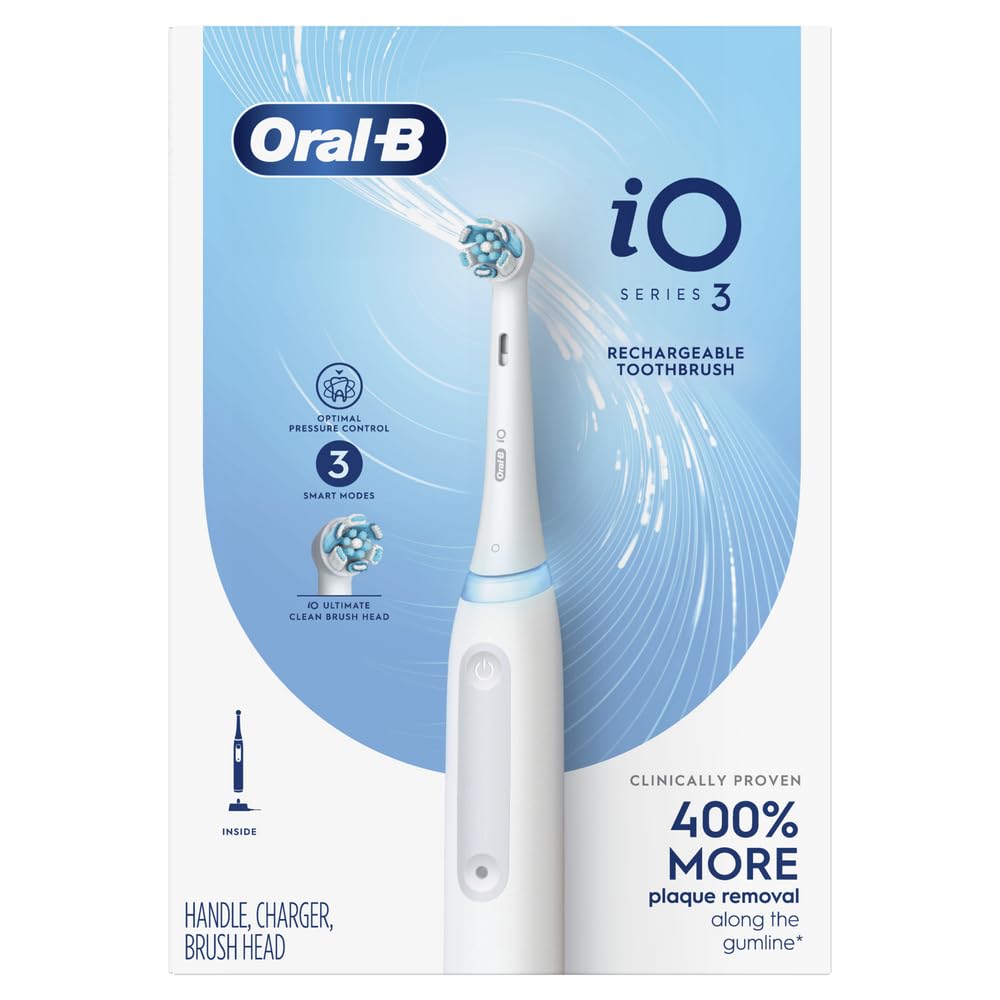 Oral-B iO3 beside a smartphone for scale to show compact size