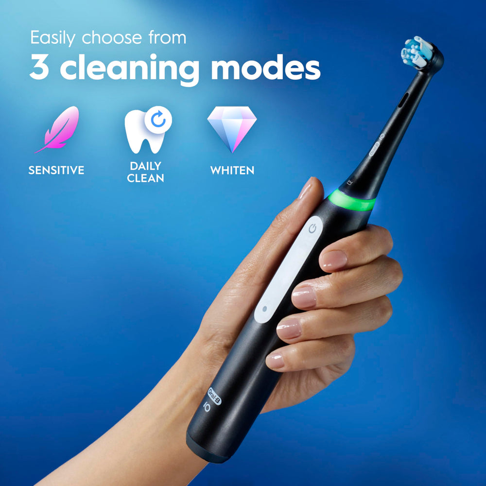 Oral-B travel case open holding handle and heads for protected on-the-go brushing