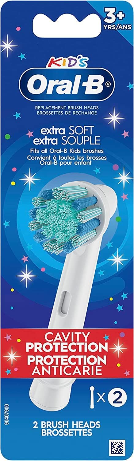 Oral-B child using electric toothbrush with replacement head demonstrating effective cleaning