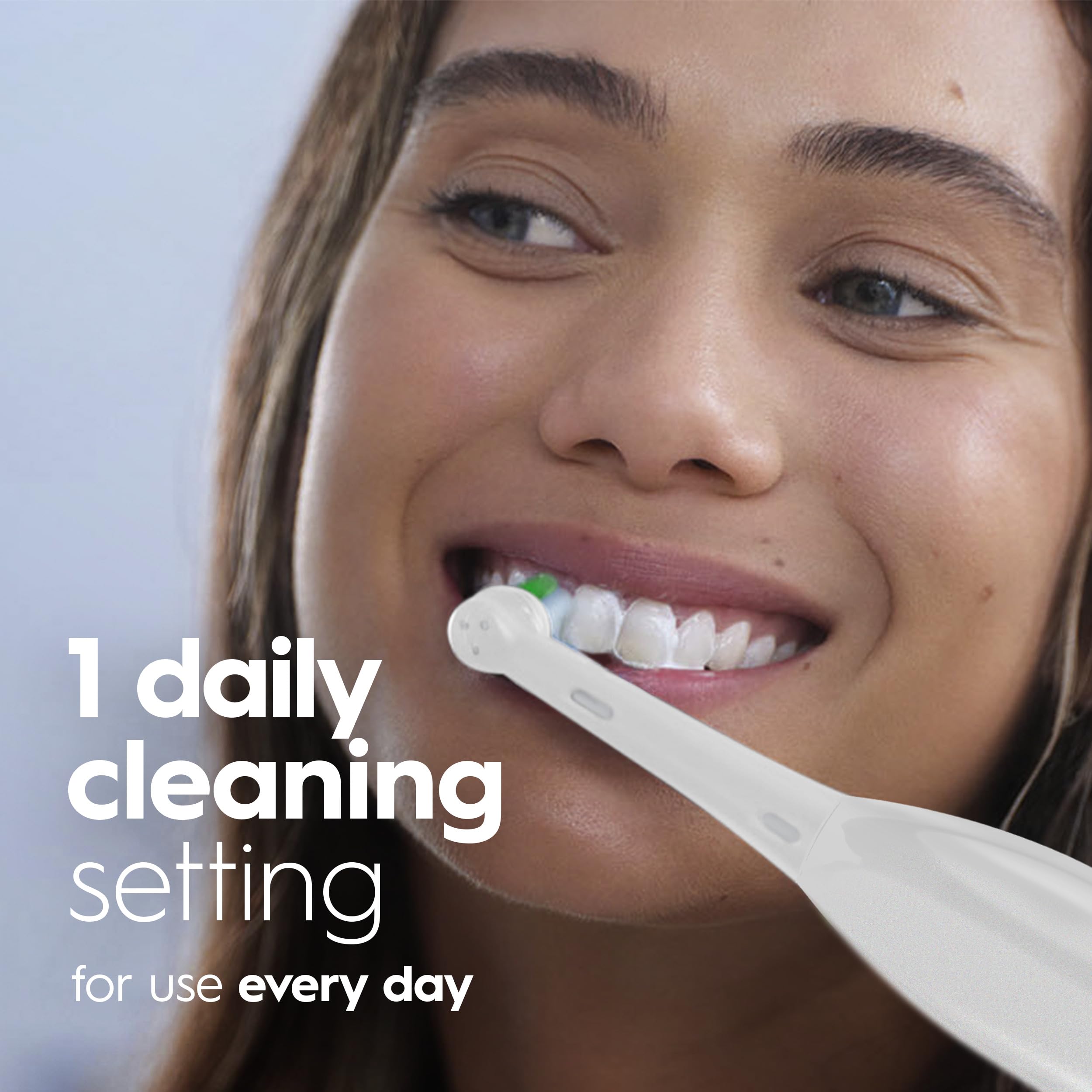 Person using Oral-B Pro 100 in bathroom delivering consistent cleaning action