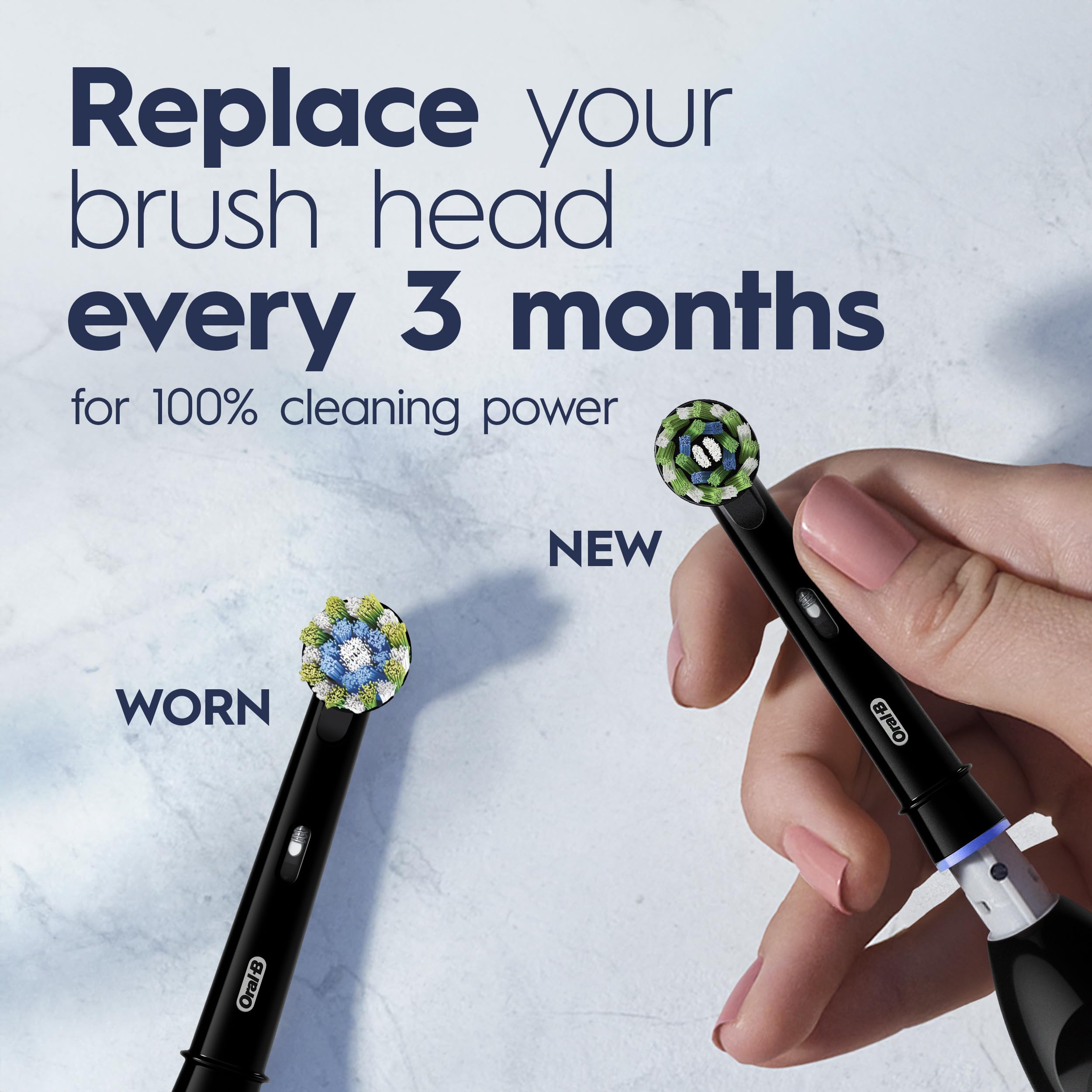 Oral-B toothbrush in hand showing compact size for travel convenience