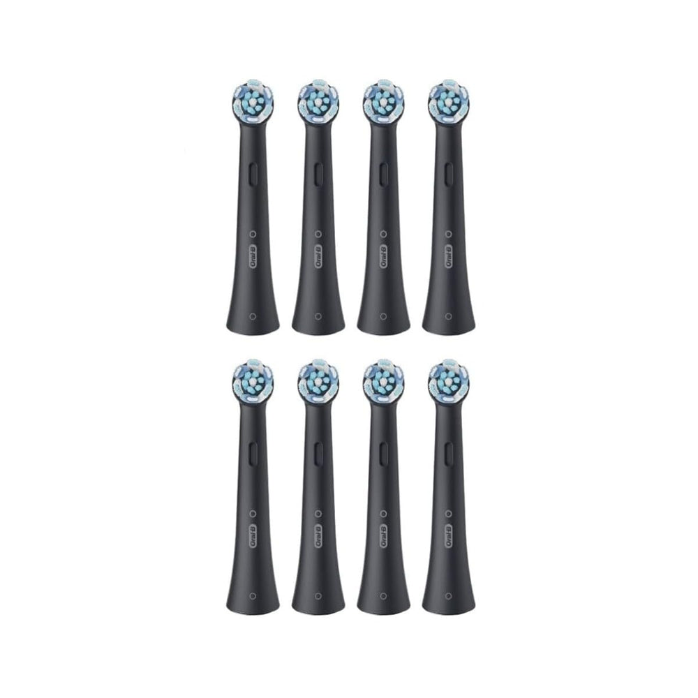 Oral-B toothbrush head in use close-up demonstrating bristle contact for improved plaque removal