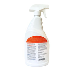 Orange Guard being sprayed along a baseboard to prevent re-entry