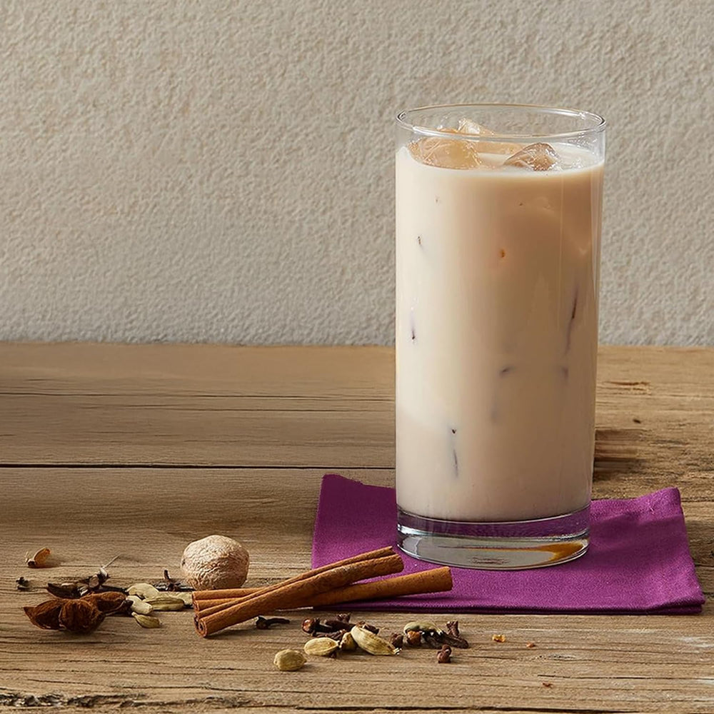 Action shot of mixing Oregon Chai concentrate with milk to show easy customization benefit