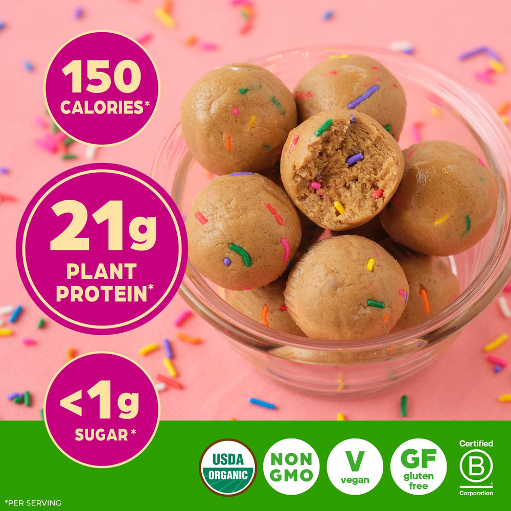 Orgain Birthday Cake with baking ingredients flatlay showing recipe versatility