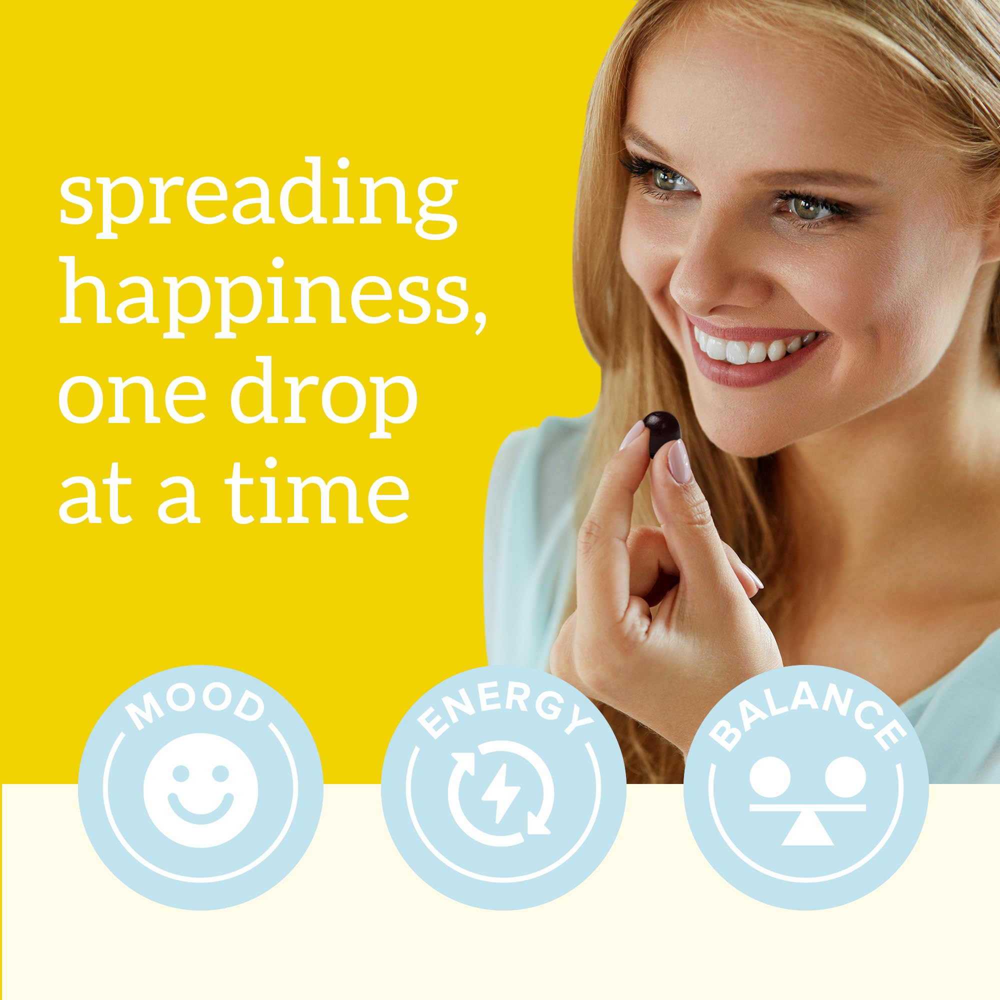 Organifi Happy Drops two gummies on palm showing recommended serving and convenience
