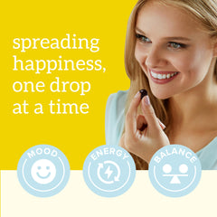 Organifi Happy Drops two gummies on palm showing recommended serving and convenience