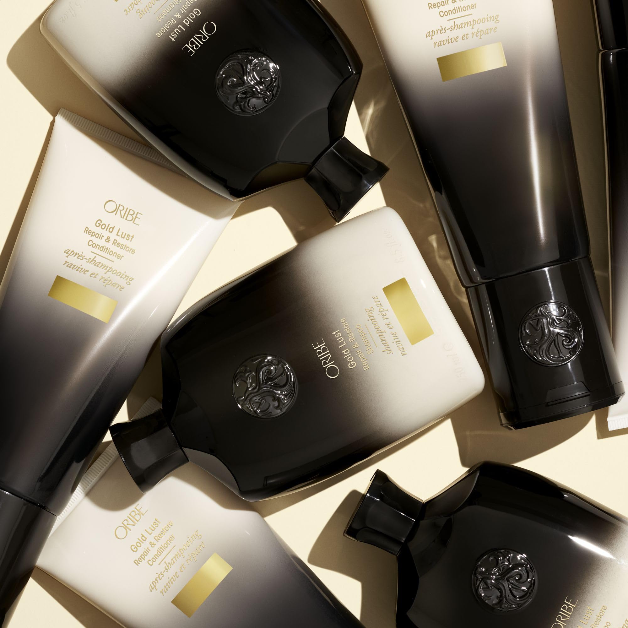 Oribe Gold Lust shampoo in shower scene illustrating salon-quality home treatment