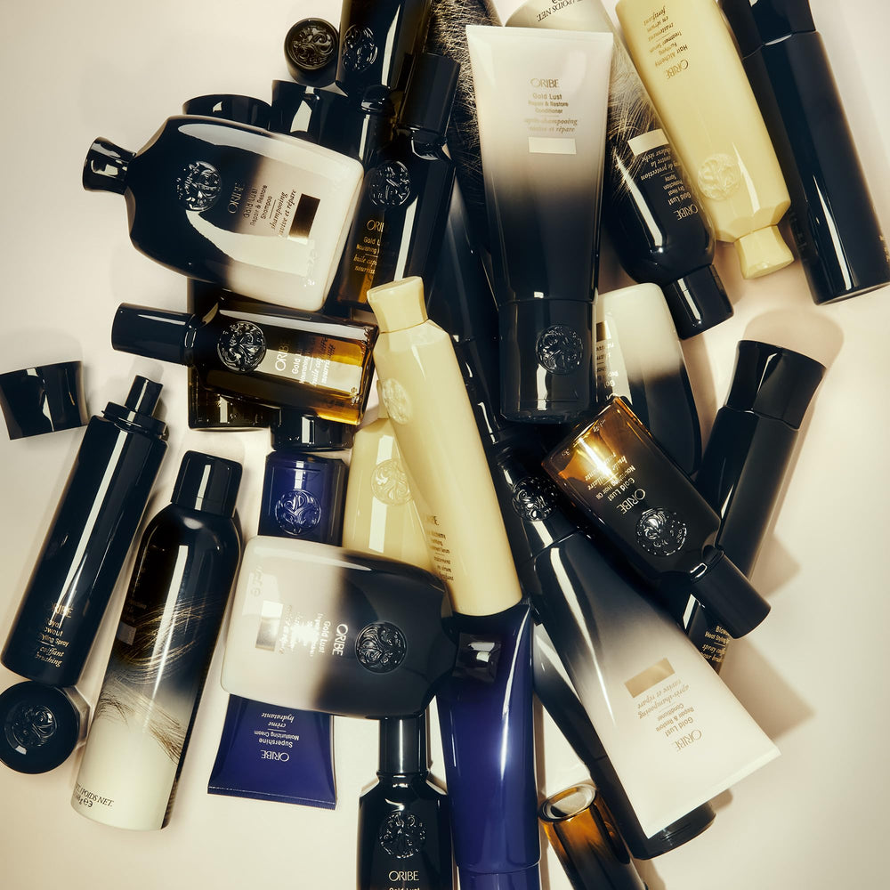 Oribe Gold Lust shampoo on vanity in lifestyle setting showcasing luxury ritual