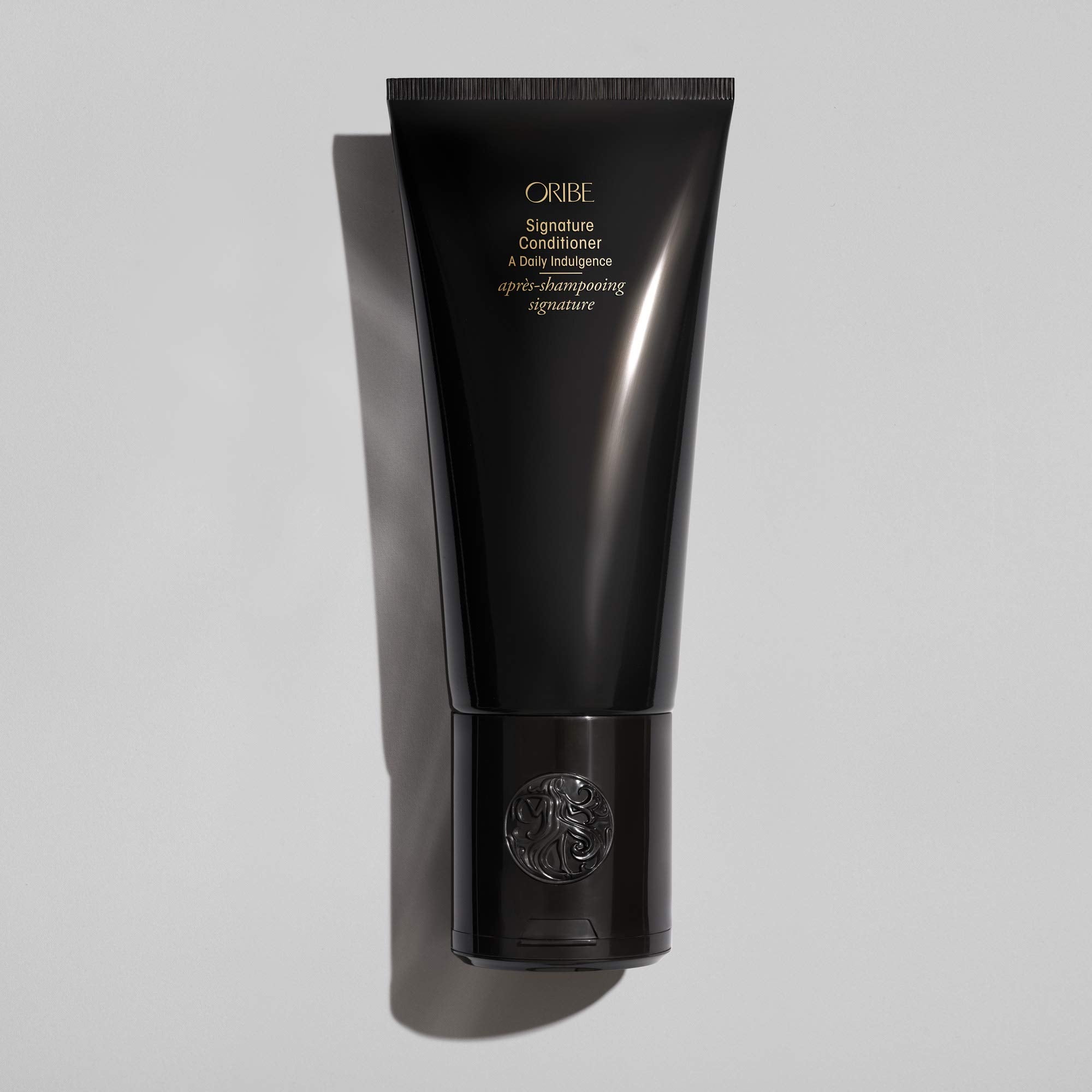 Oribe Signature Conditioner creamy texture close-up showing hydrating consistency