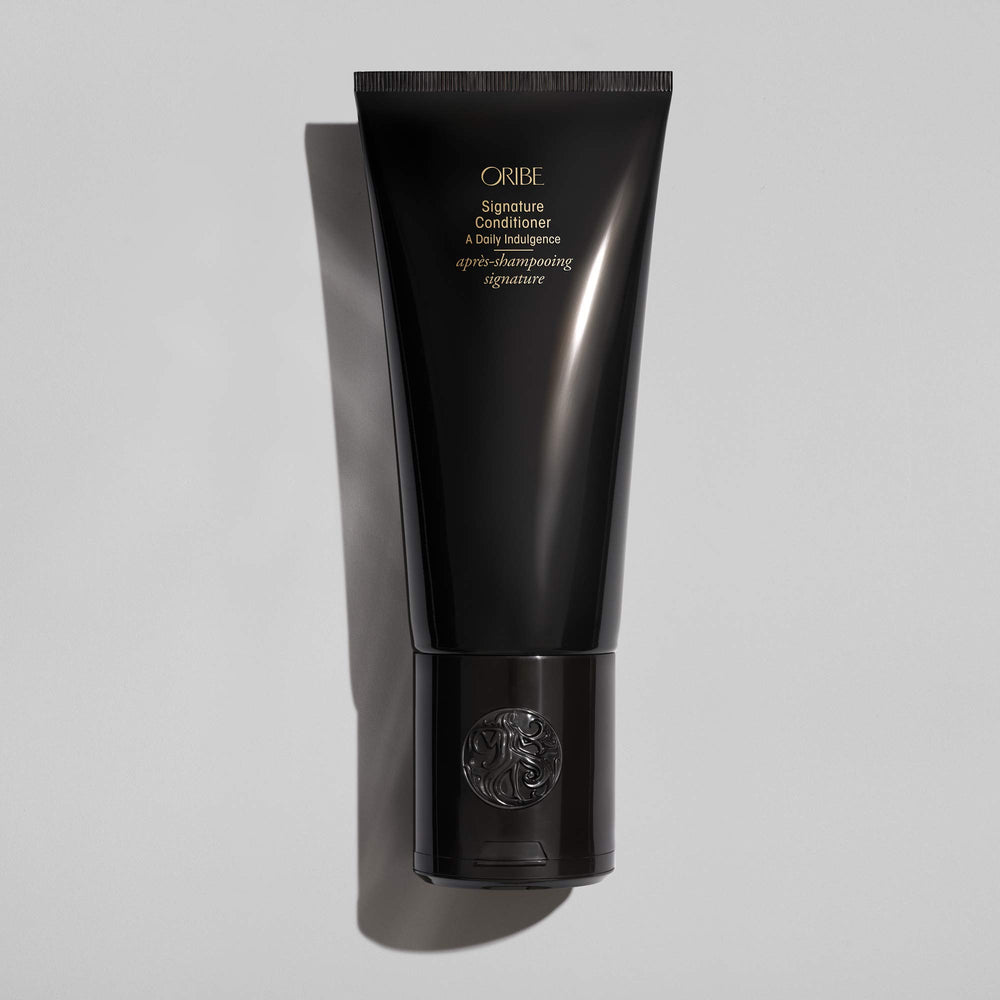 Oribe Signature Conditioner creamy texture close-up showing hydrating consistency