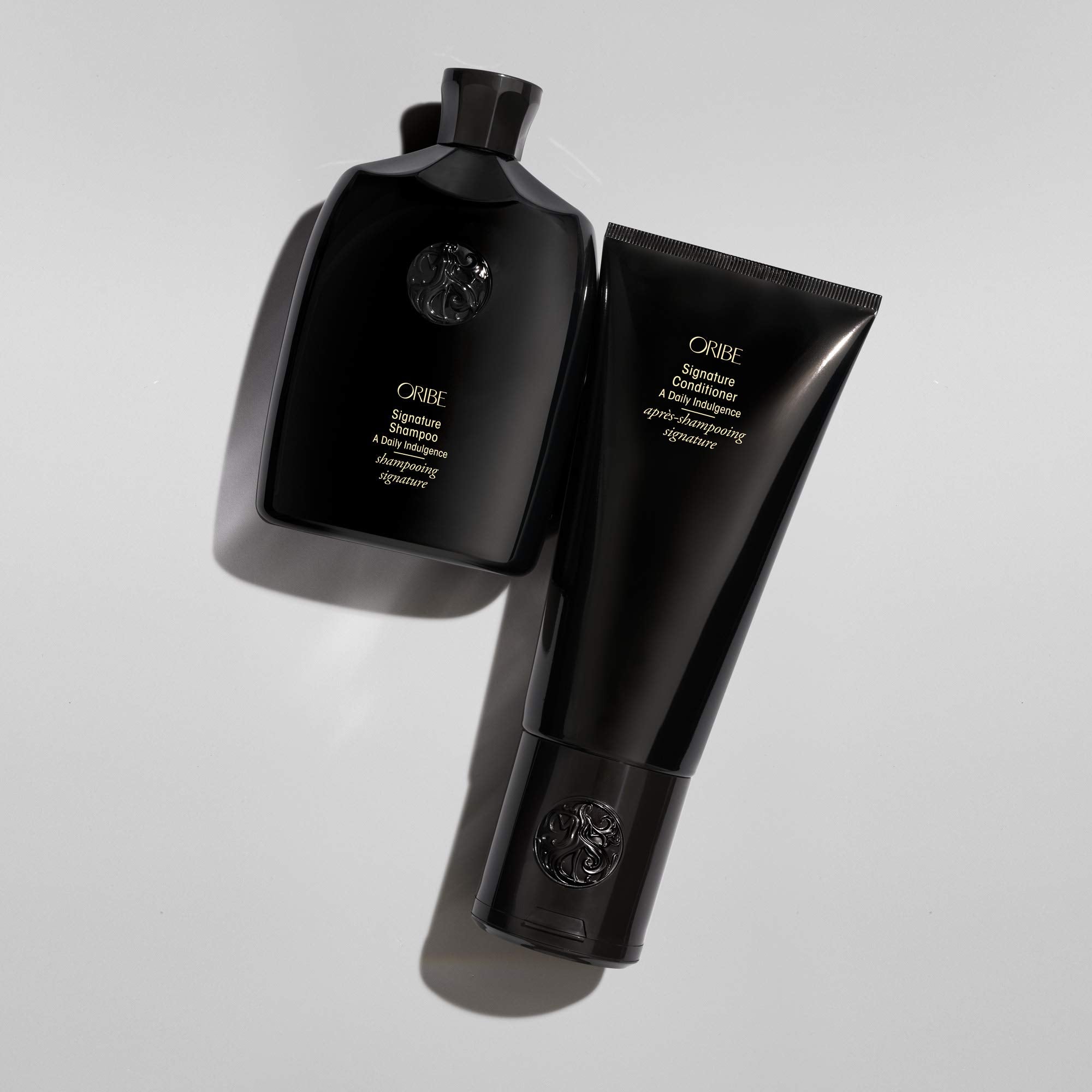 Oribe signature shampoo styled bathroom lifestyle shot conveying indulgent routine