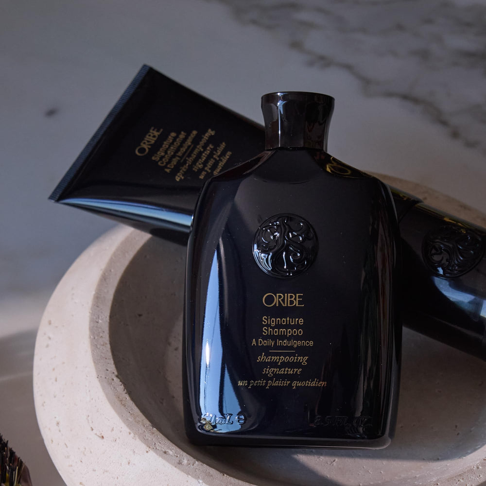 Oribe signature shampoo before and after hair showing improved shine and manageability