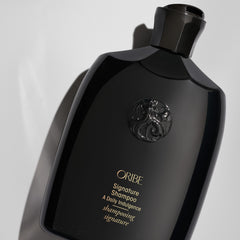 Oribe signature shampoo pump and cap detail for easy daily dispensing