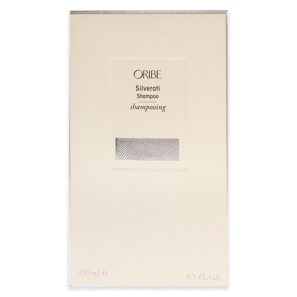 Oribe Silverati bottle next to ruler to show 8.5 oz size and travel practicality