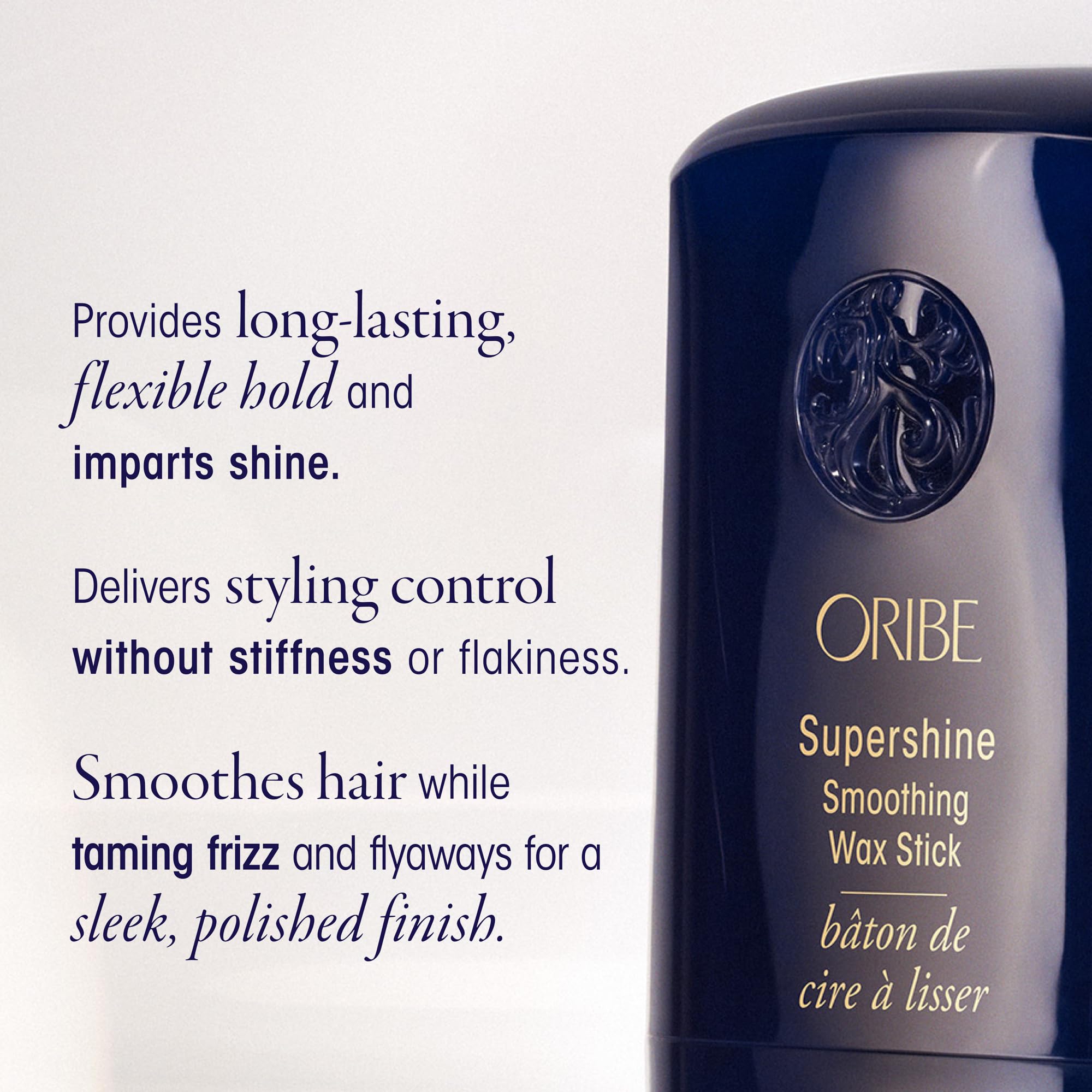 Oribe wax stick held in hand to show scale and travel-friendly benefit