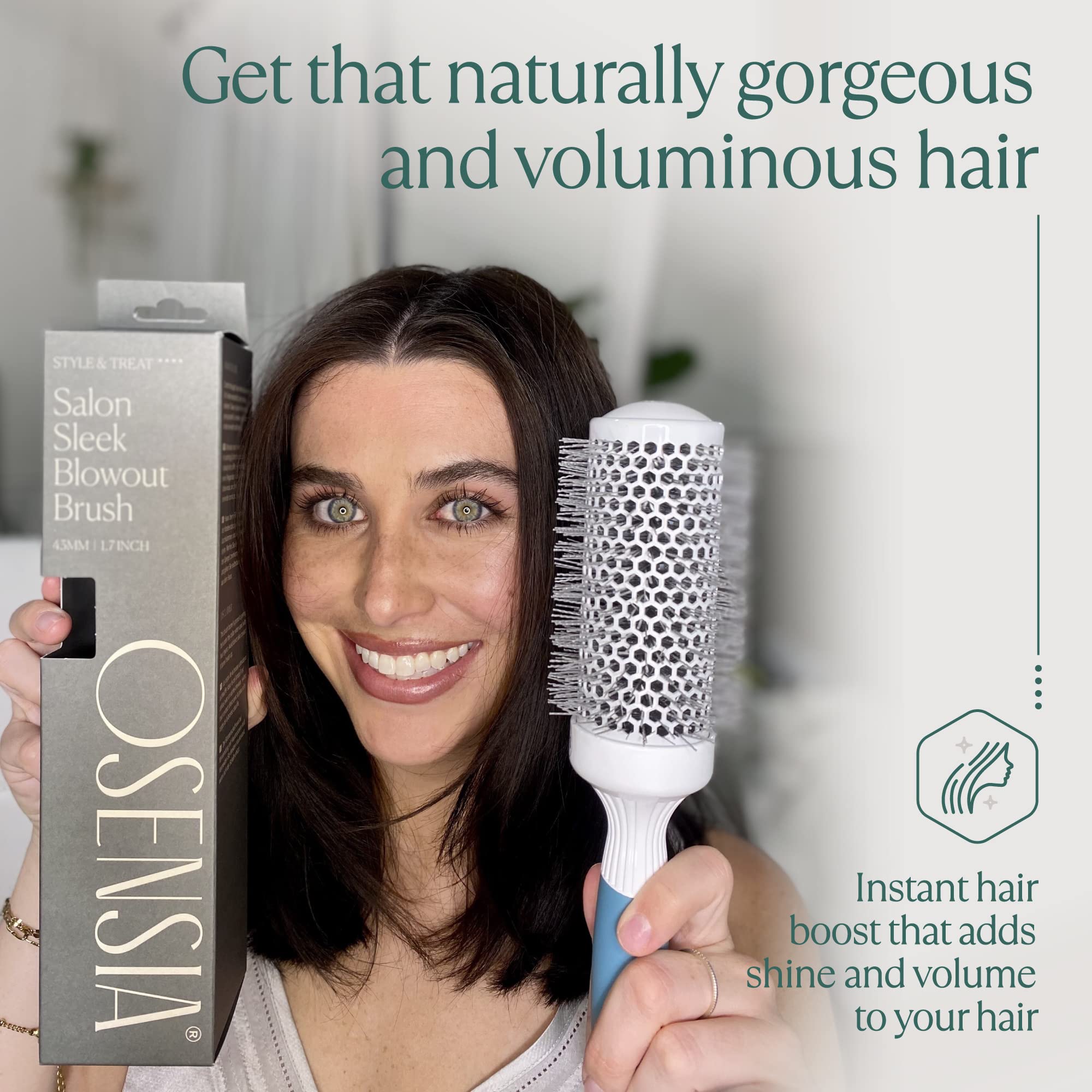 Osensia brush in use with hairdryer creating smooth, volumized sections while speeding dry time