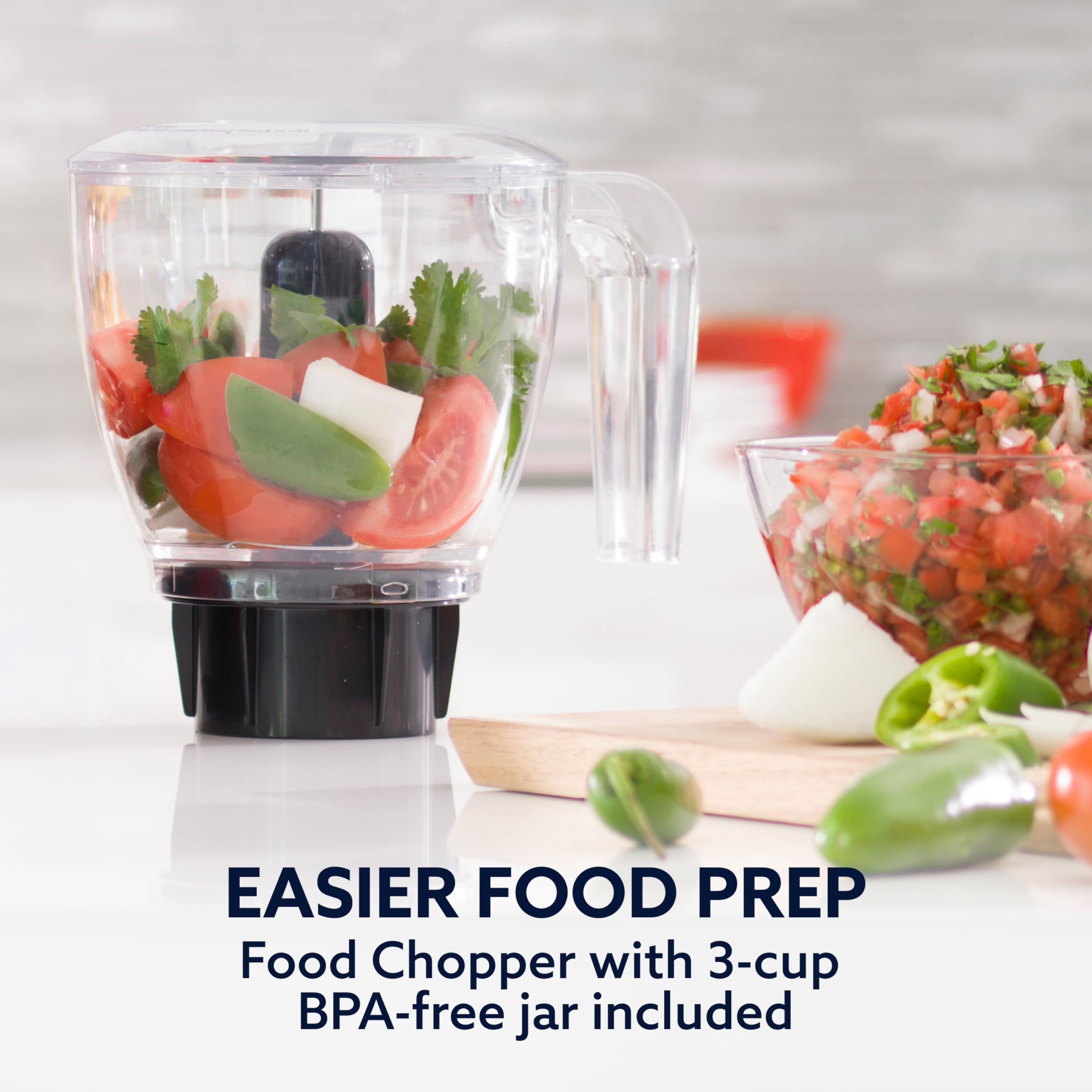 Oster blender next to coffee mug showing size and countertop-friendly footprint