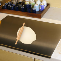OTAVILEM cutting board in use chopping vegetables demonstrating stability and easy cleanup
