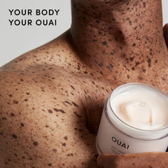 OUAI body cream being scooped onto hand demonstrating easy application benefit