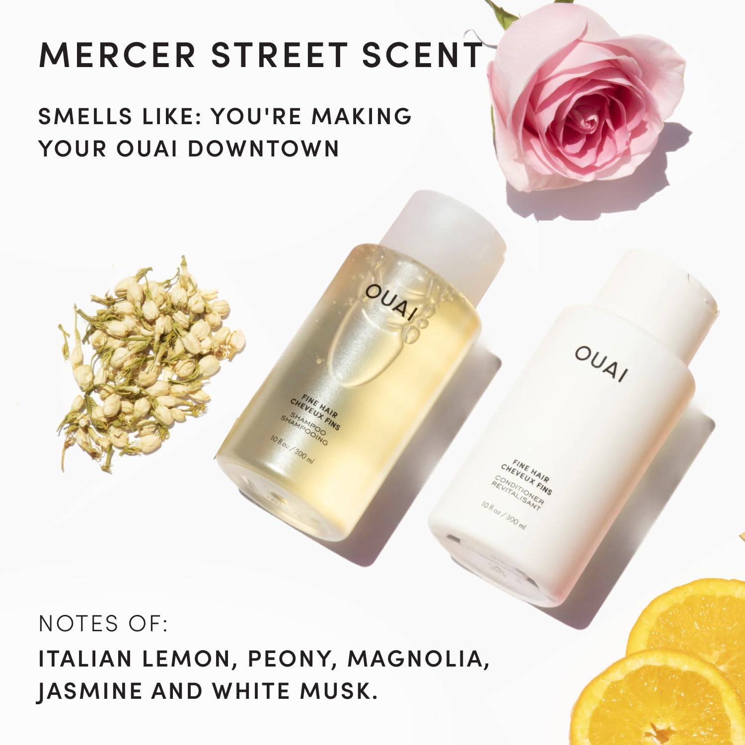 OUAI bottles in hand for scale demonstrating compact 3 oz size perfect for carry-on