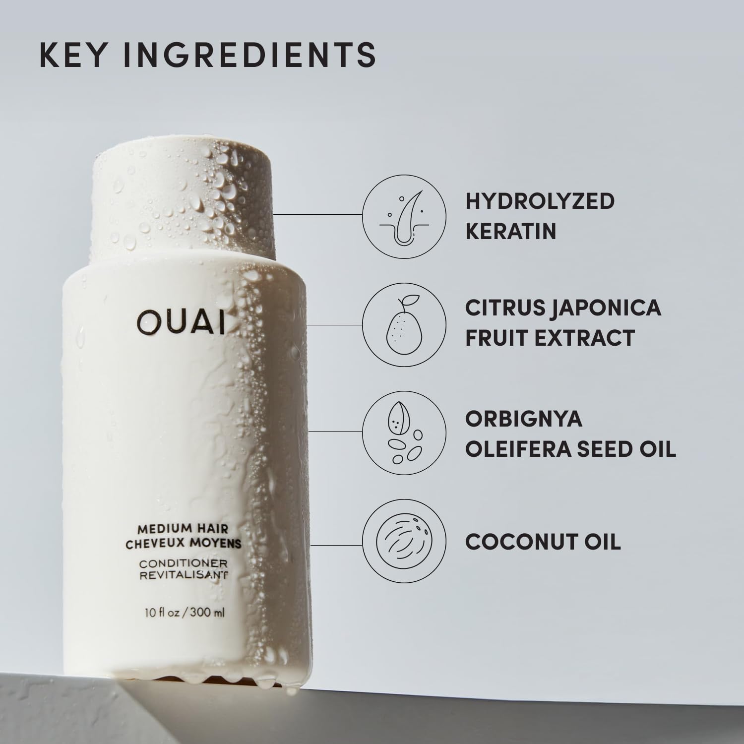 OUAI 10 oz bottle beside a ruler showing actual size and travel clarity