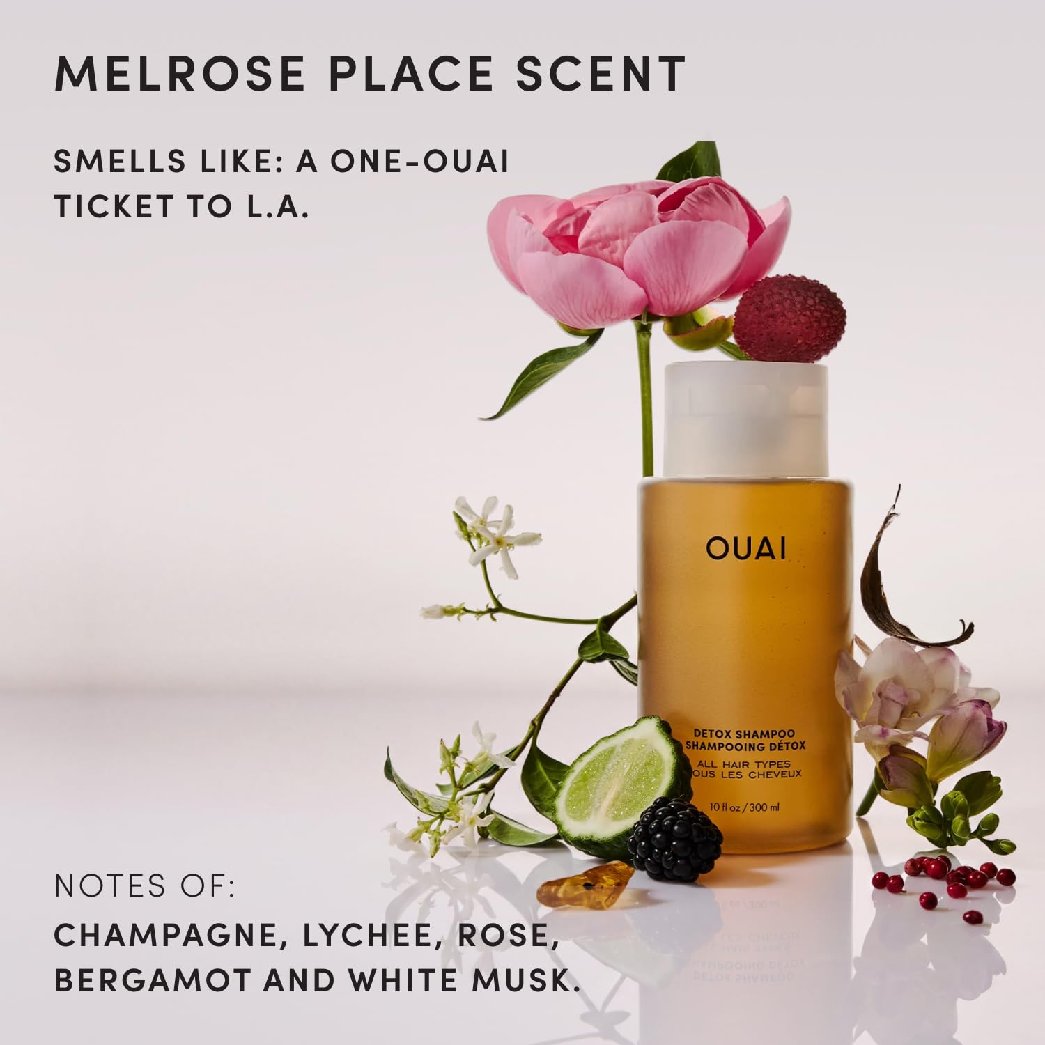 OUAI 16 oz bottle beside common items showing size and value