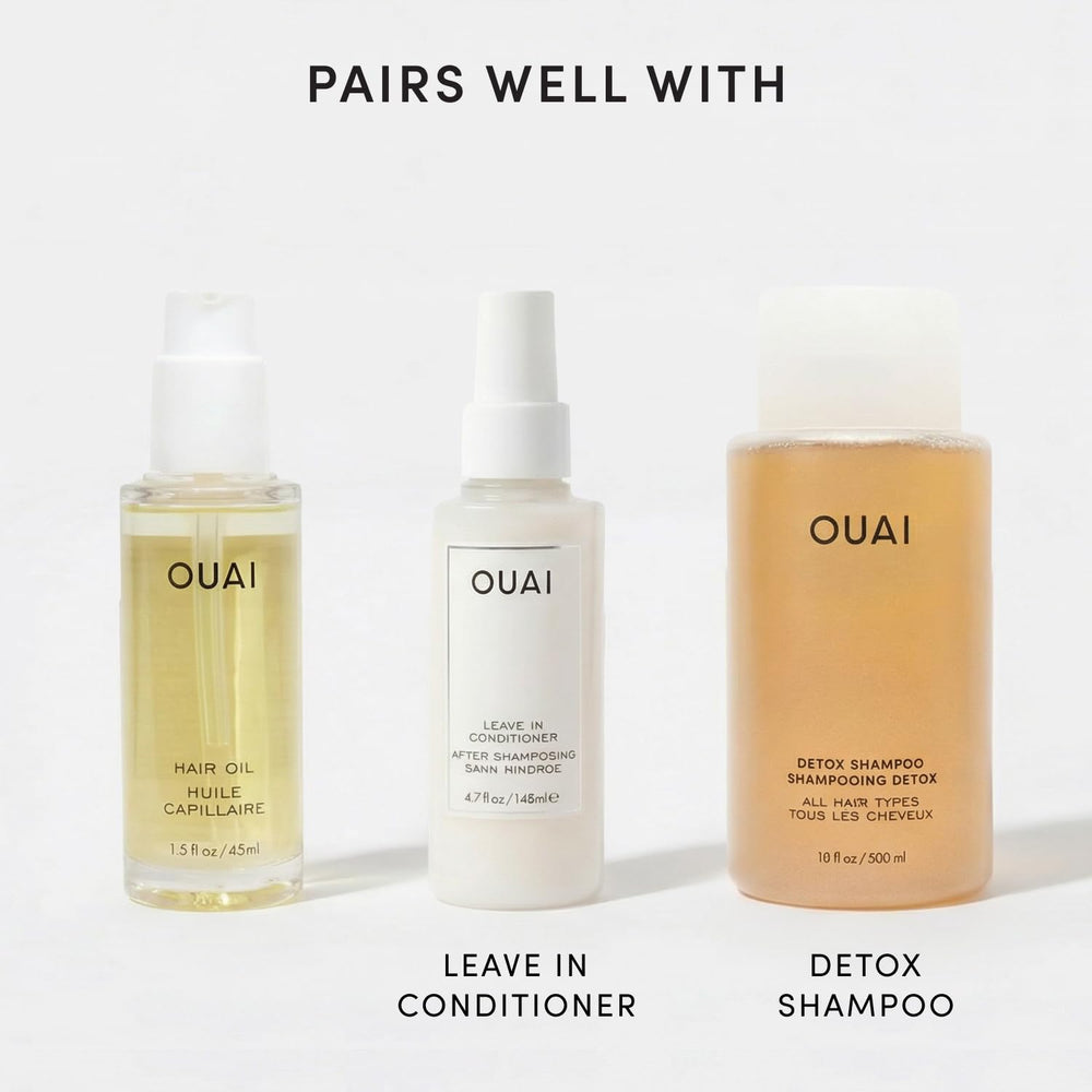 OUAI label close-up highlighting heat protection and ingredient benefits