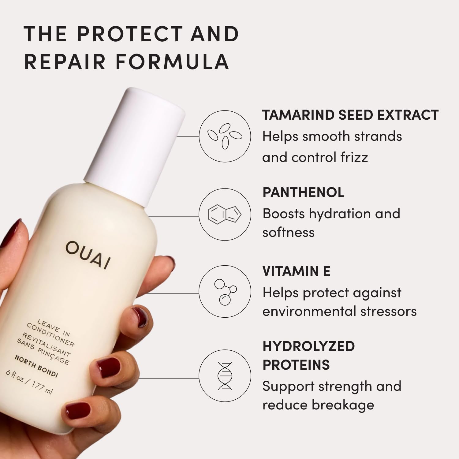 OUAI bottle near styling tools showing prep for blow-drying