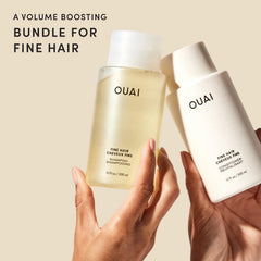 OUAI travel-size 3 oz shampoo and conditioner bottles top view highlighting portability benefit