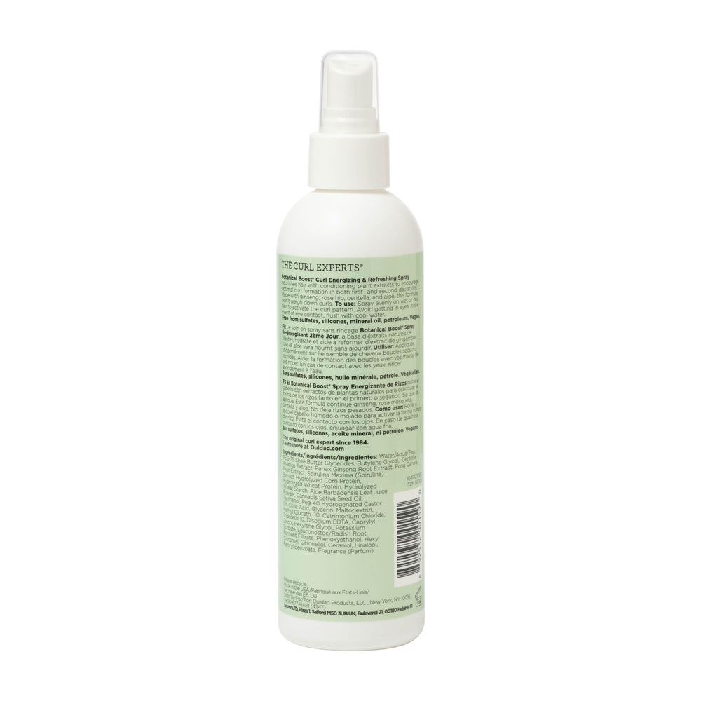 Hand spraying Ouidad mist onto curls to refresh and restore bounce