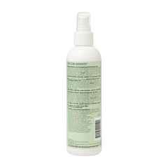 Hand spraying Ouidad mist onto curls to refresh and restore bounce