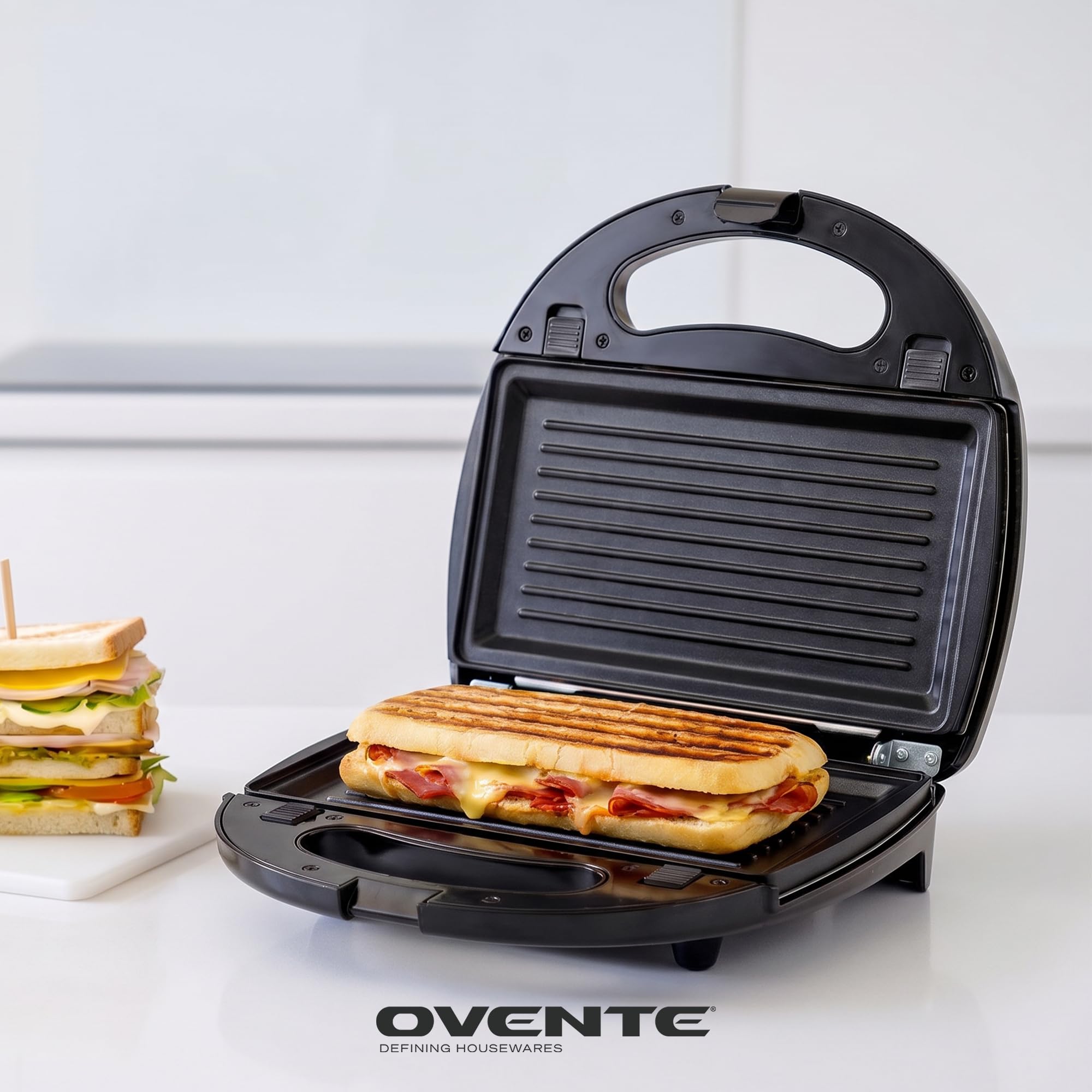 OVENTE plated waffles in kitchen setting showing breakfast-ready convenience benefit