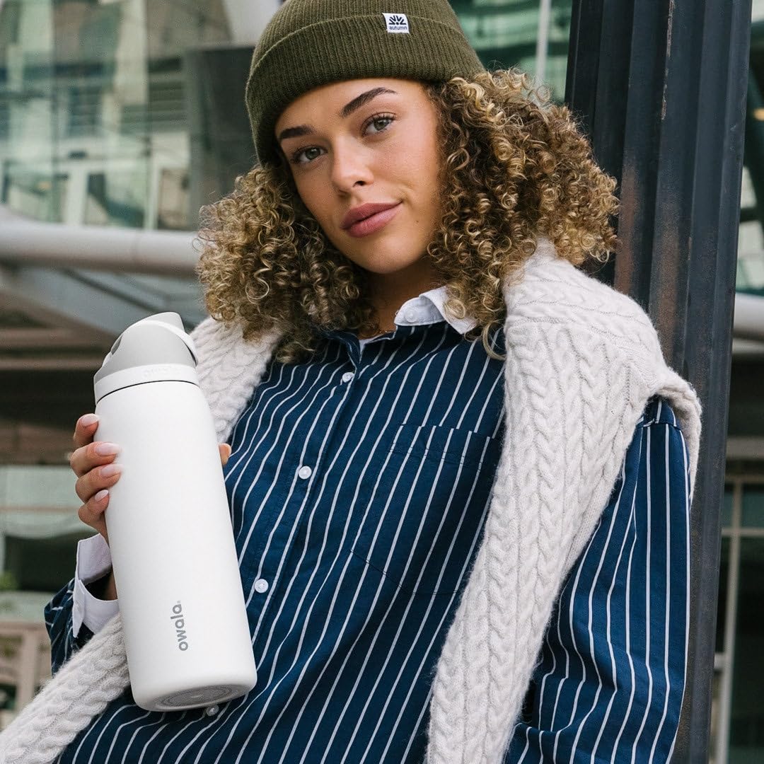 Owala FreeSip on picnic blanket outdoors showing everyday hydration and style
