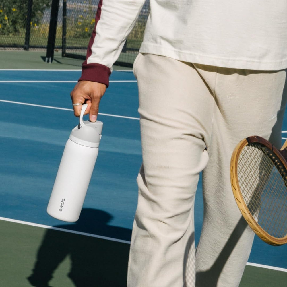 Owala FreeSip in an outdoor setting illustrating portable, cold-retaining hydration
