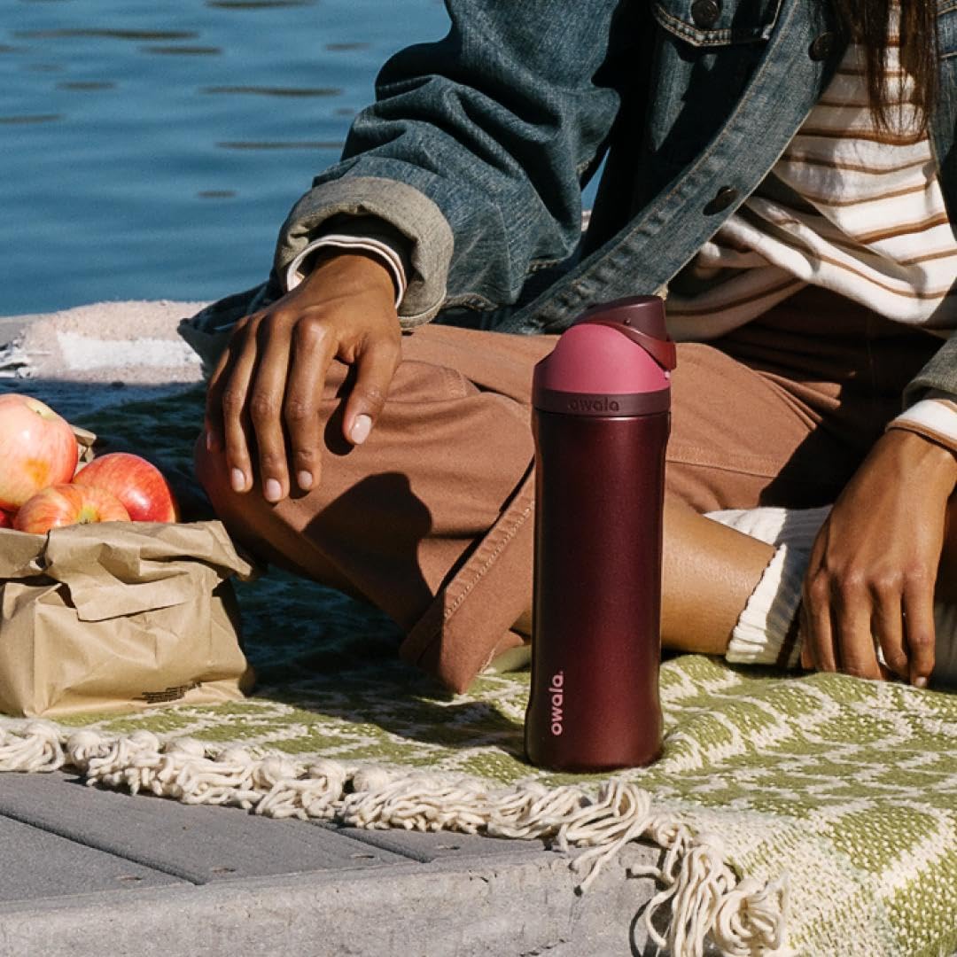Owala FreeSip in a picnic setting showing the bottle in everyday outdoor use