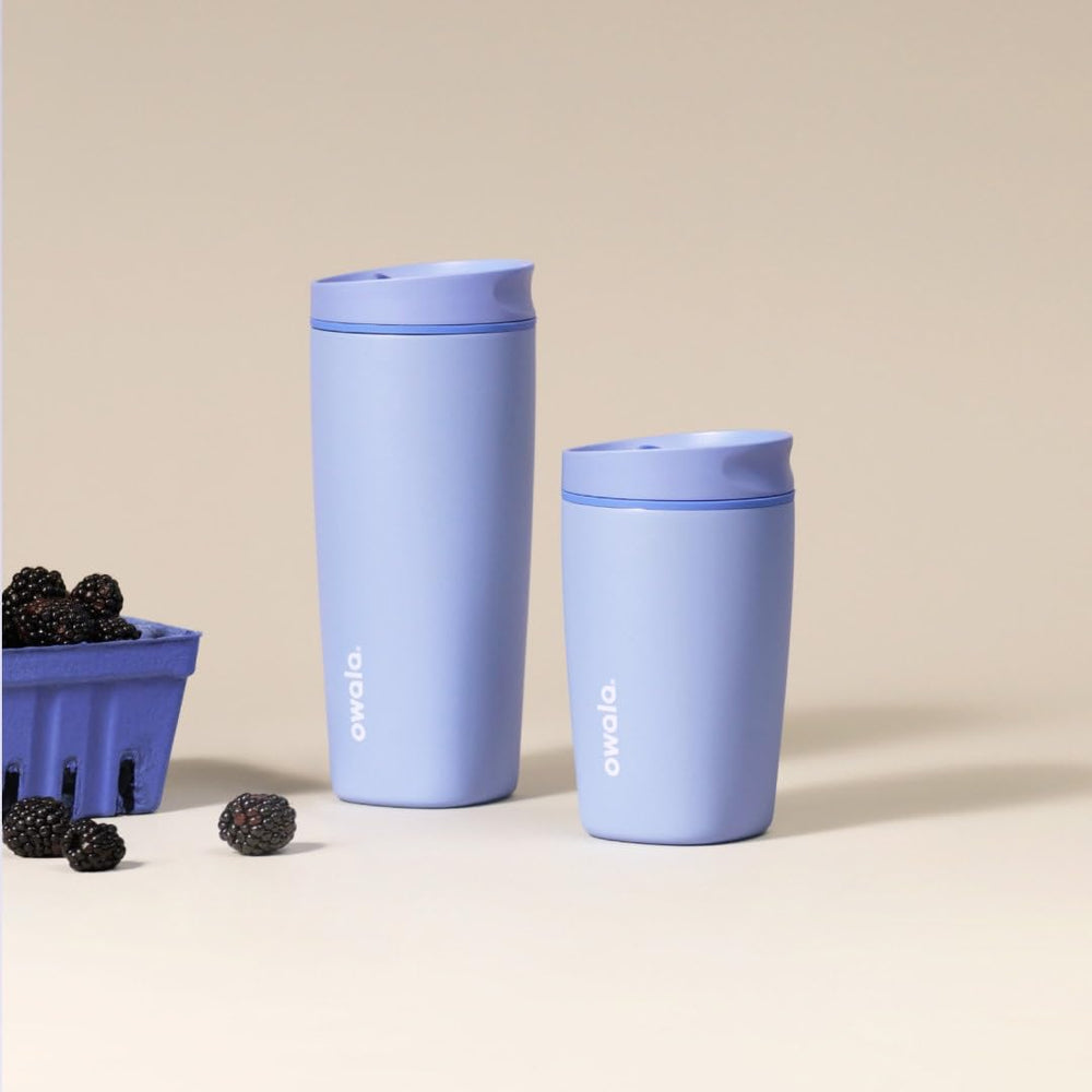 Owala SmoothSip Slider in a commuter setting in a cup holder demonstrating spill-resistant travel use