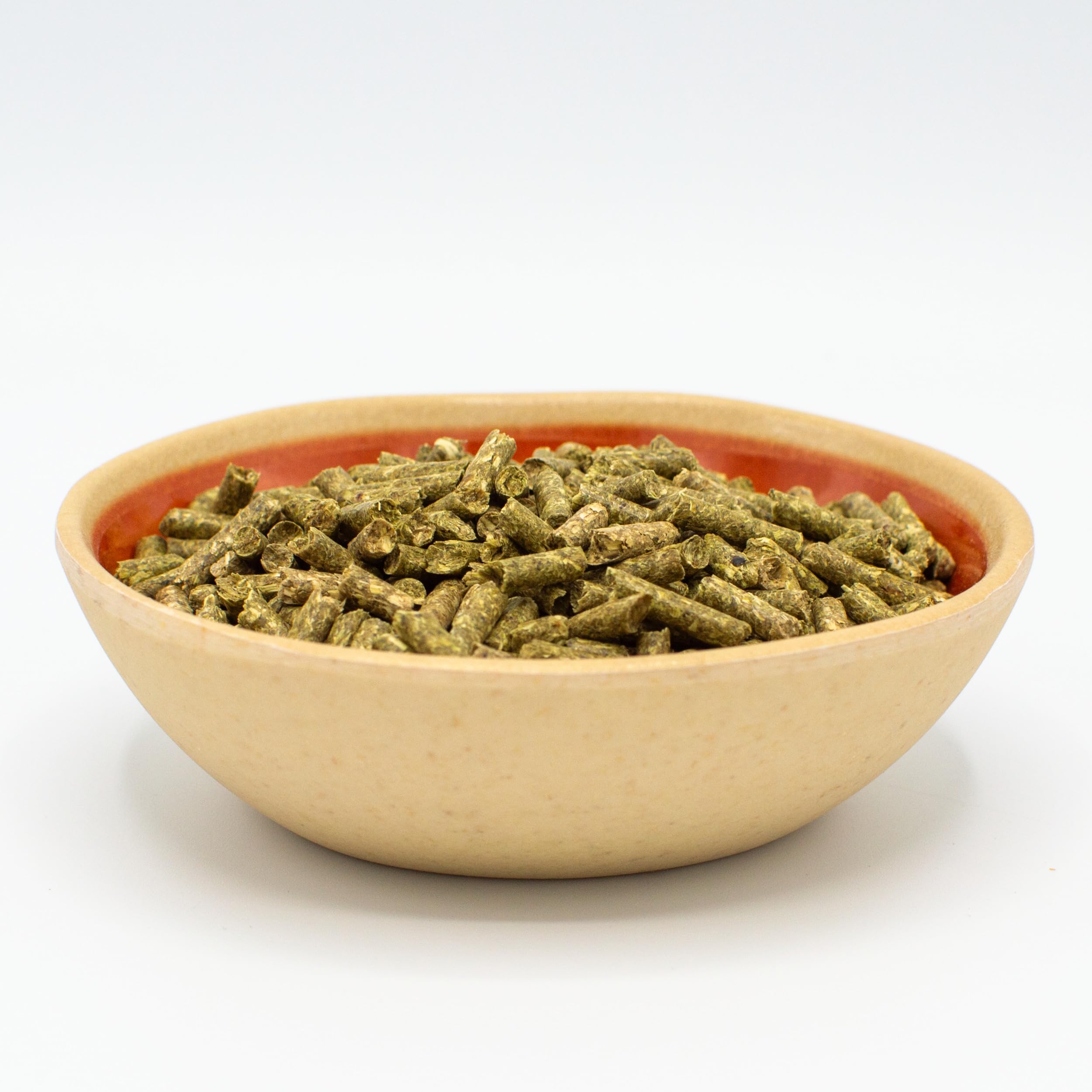 Oxbow rabbit eating from bowl promoting digestive health