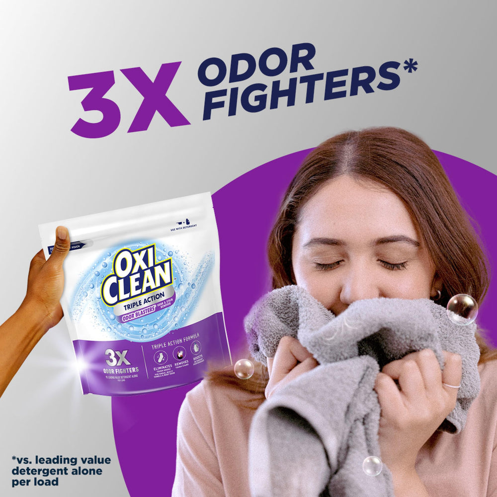 Measuring scoop with OxiClean powder demonstrating dosage control for better washing results