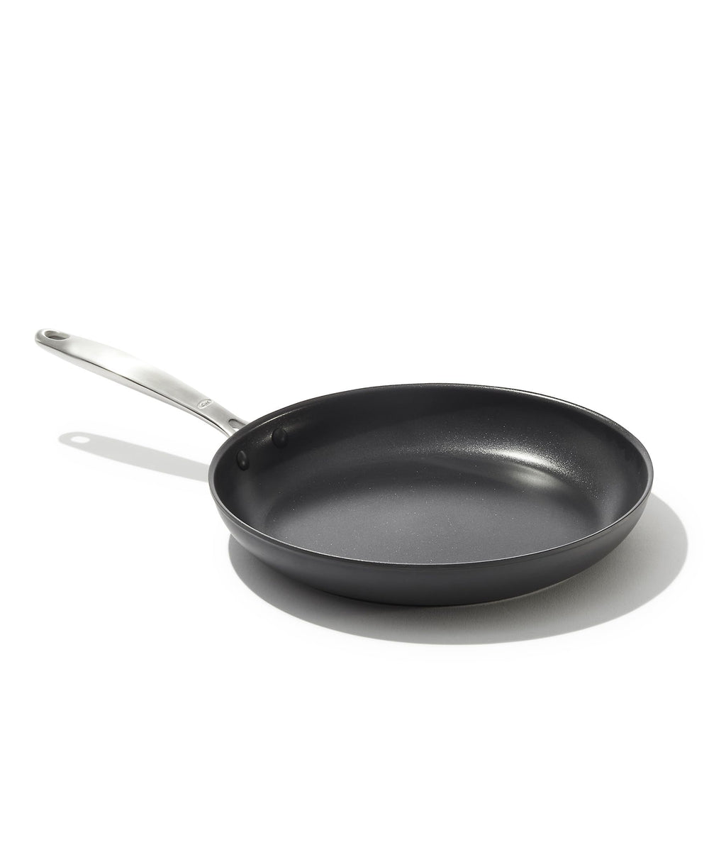 OXO 10-inch frying pan front view showing sleek black finish and ergonomic handle benefits