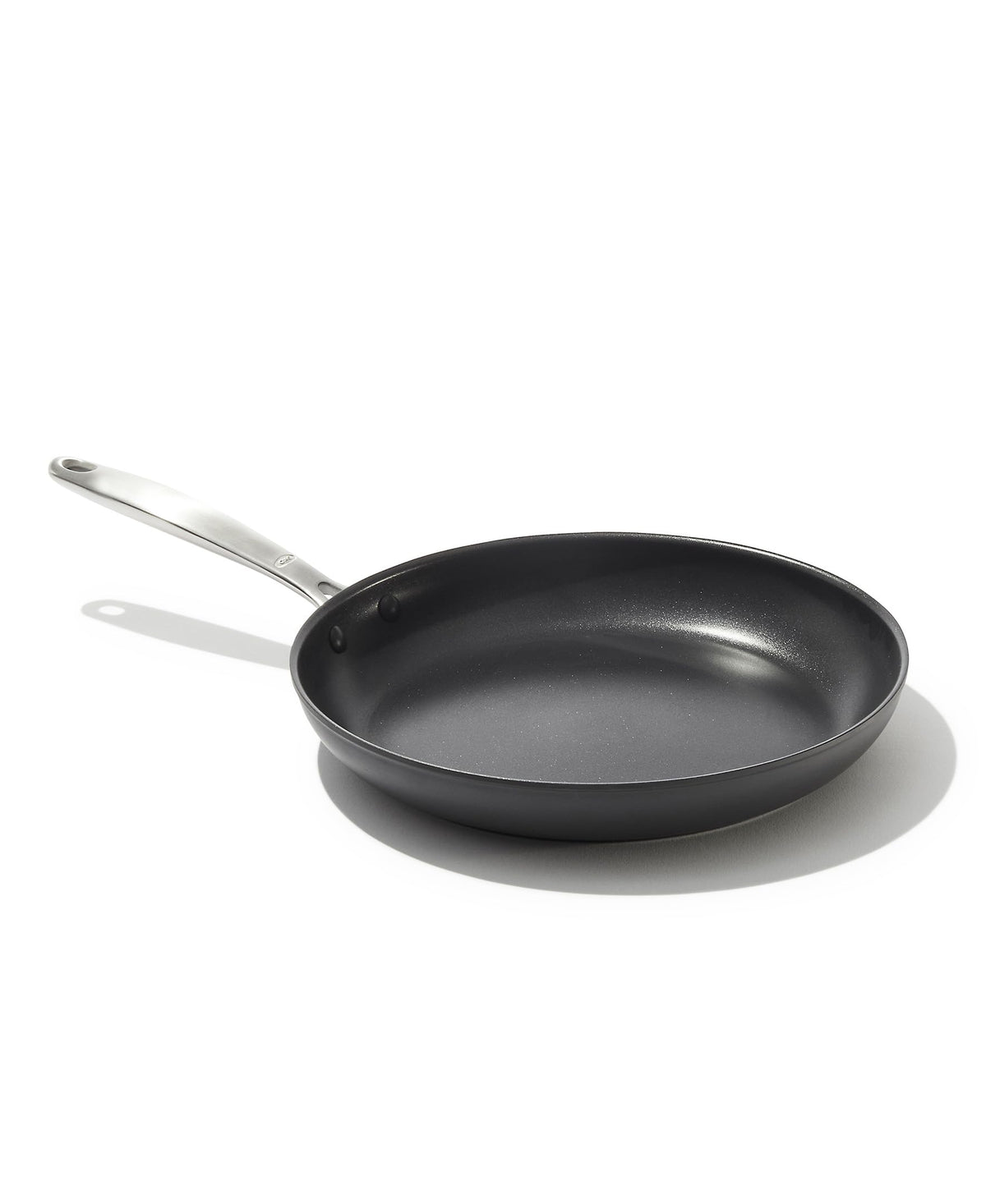 OXO 10-inch frying pan front view showing sleek black finish and ergonomic handle benefits