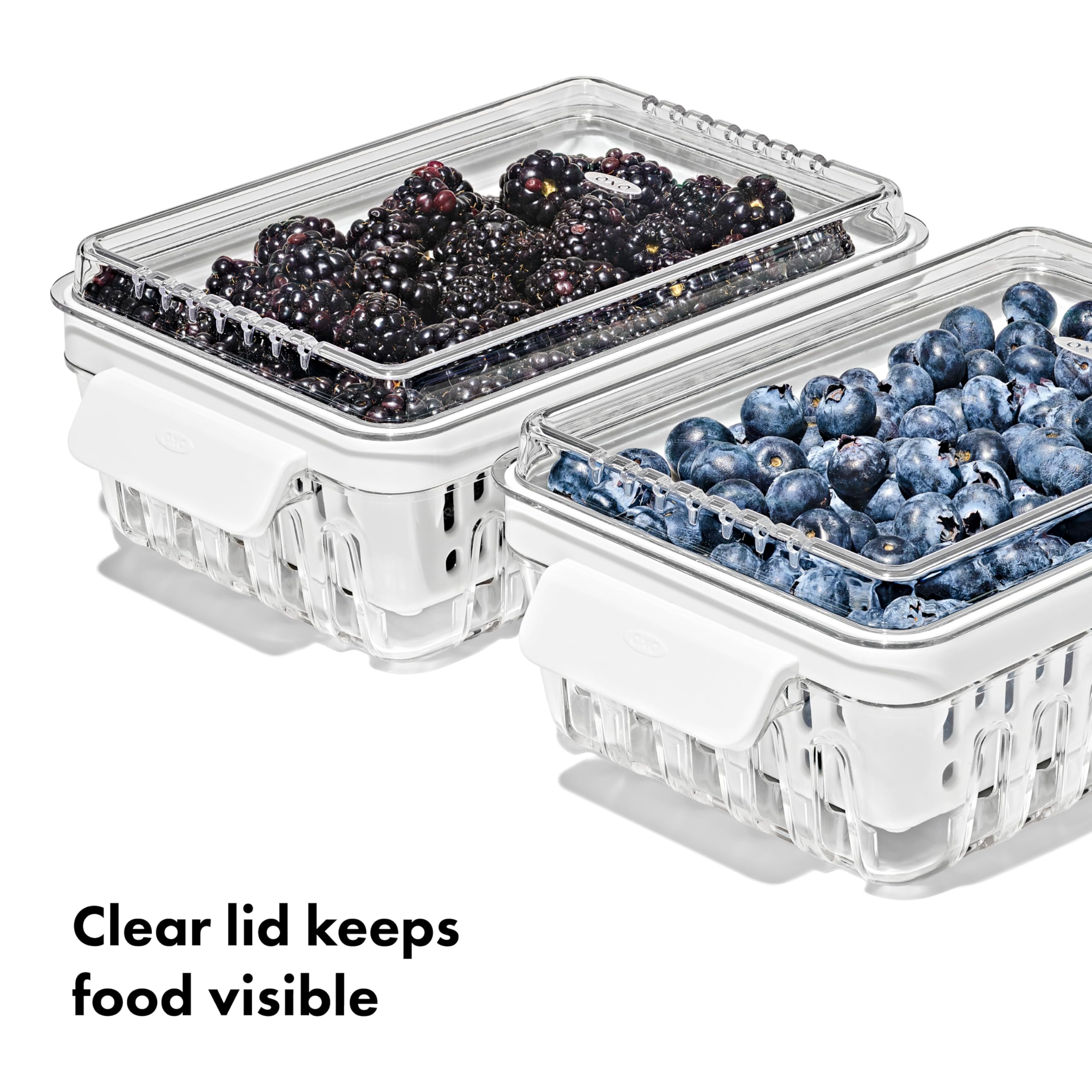 OXO Berry Keeper in use rinsing berries in removable basket for easy prep