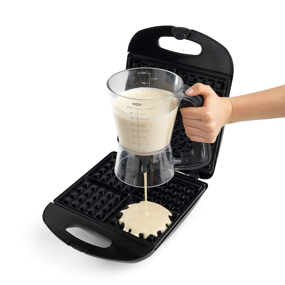 OXO Good Grips pouring pancake batter onto griddle for consistent round pancakes