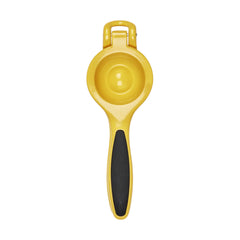 OXO Good Grips citrus squeezer beside glass to show scale and precise pouring benefit