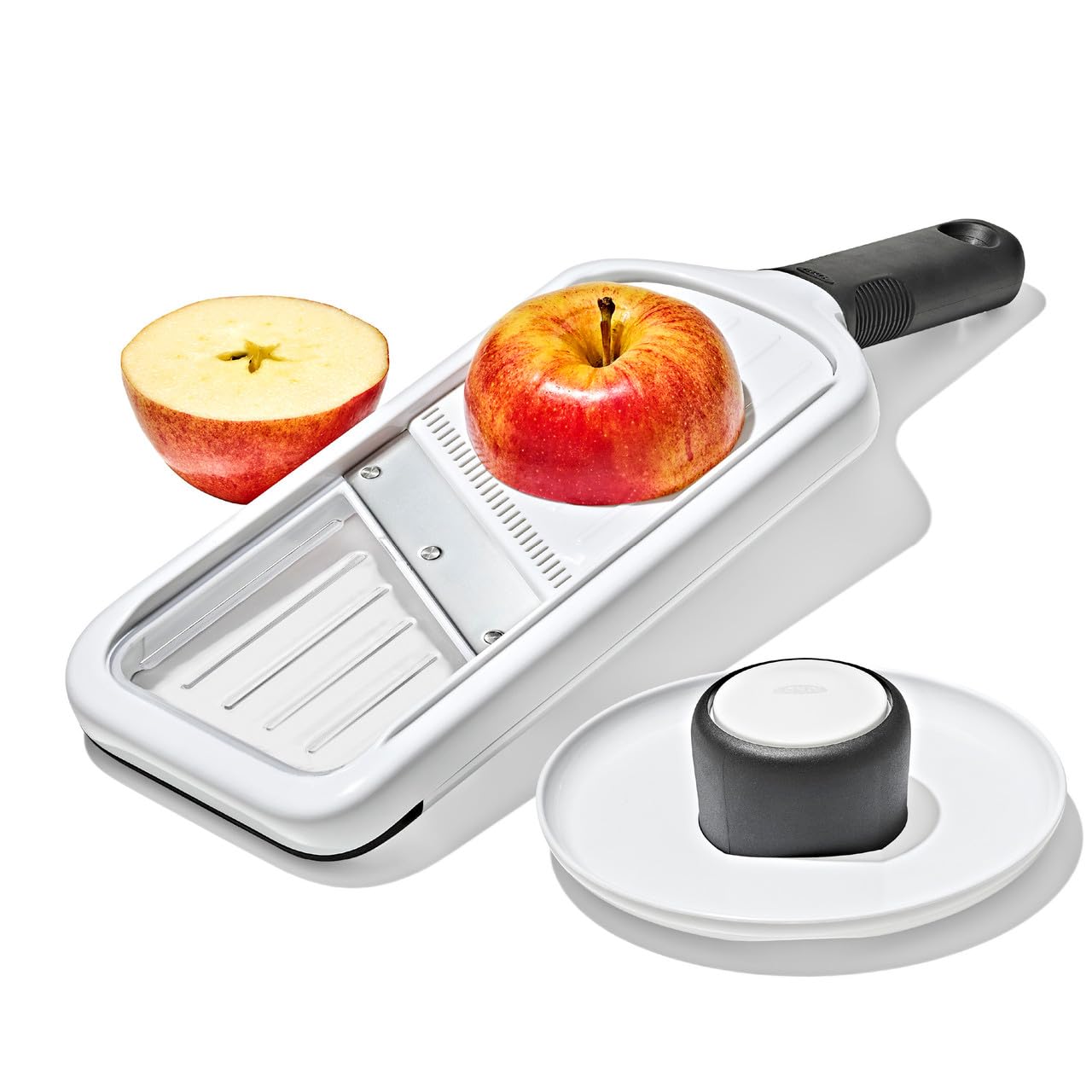 OXO Good Grips food holder detail showing height adjustment and finger protection