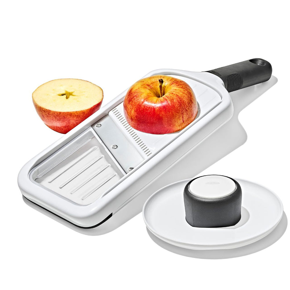 OXO Good Grips food holder detail showing height adjustment and finger protection