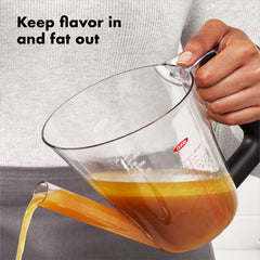 OXO Good Grips pouring hot drippings leaving fat behind for lighter gravy