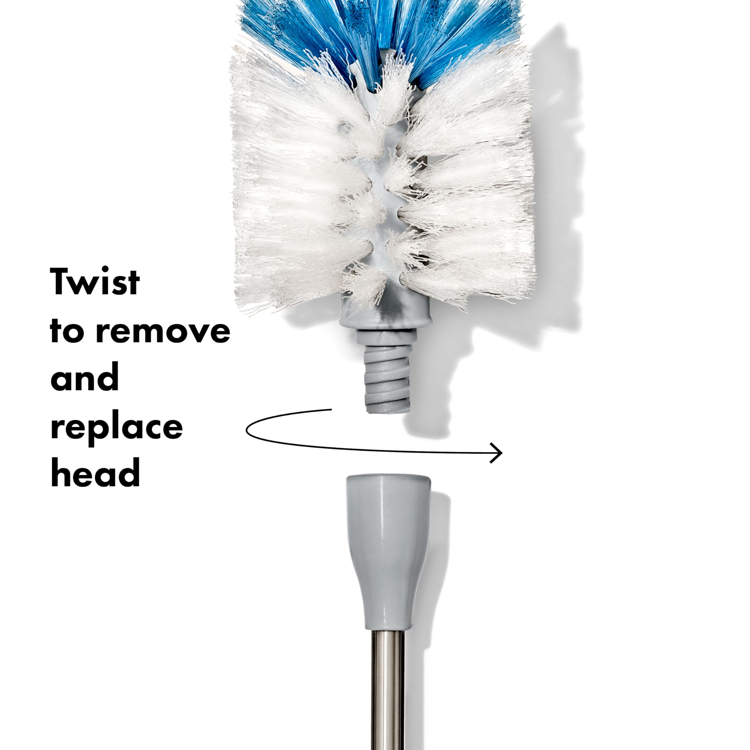 OXO brush in use inside tall water bottle reaches bottom for thorough cleaning